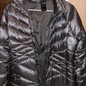 Silver puffy north face coat